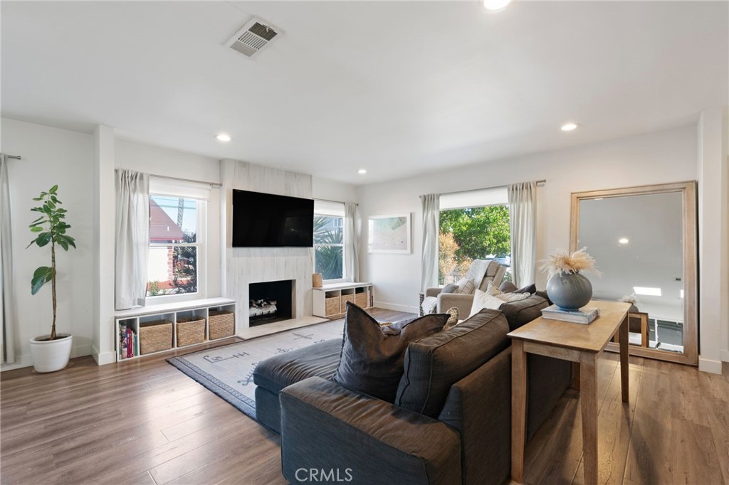 7901 Flight Los Angeles, CA 90045 - Photo 3 of 24 a living room with furniture fireplace and flat screen tv