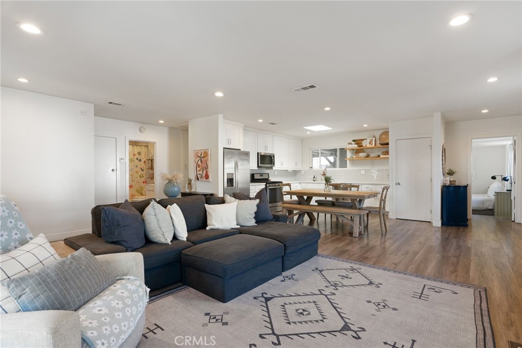 7901 Flight Los Angeles, CA 90045 - Photo 5 of 24 a living room with furniture a table and kitchen view