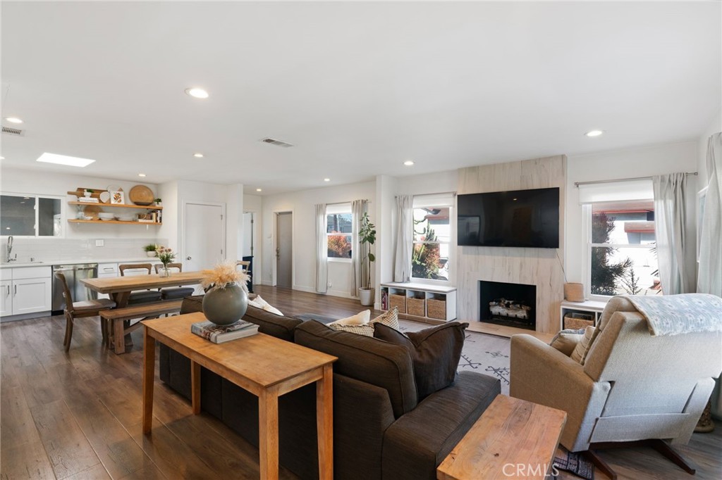 7901 Flight Los Angeles, CA 90045 - Photo 6 of 24 a living room with furniture wooden floor and a fireplace