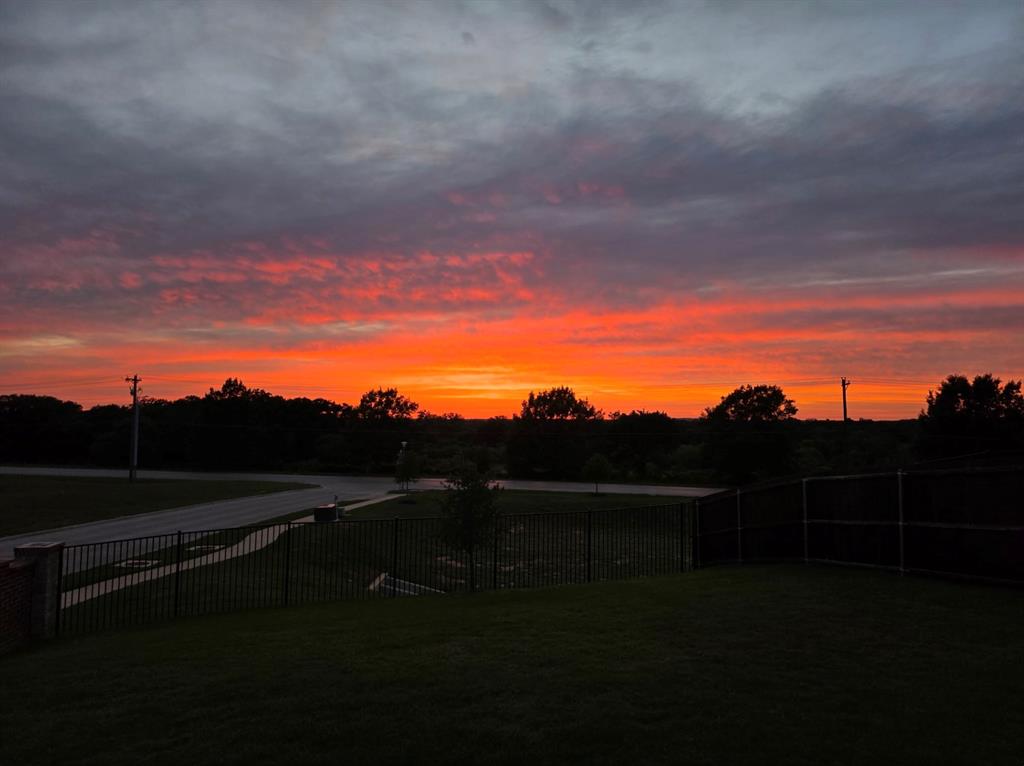 752 Ruellia Street Weatherford, TX 76086 - Photo 2 of 31 No filter sunset picture by the Seller on the back porch.