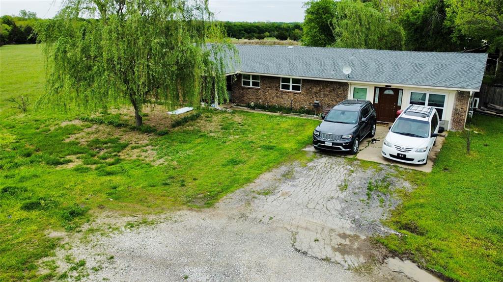 102 North Cedar Street Celeste, TX 75423 - Photo 1 of 1 a aerial view of a house with garden and trees