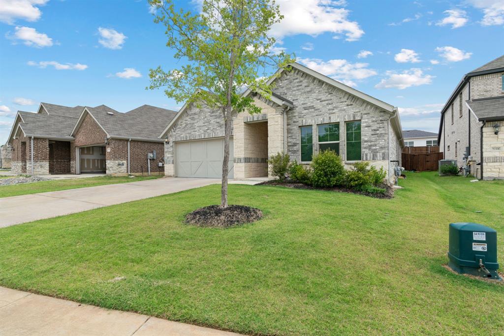3112 Kingsgarden Road Denton, TX 76207 - Photo 2 of 38 Contemporary single-story residence featuring a light brick facade and stone accents