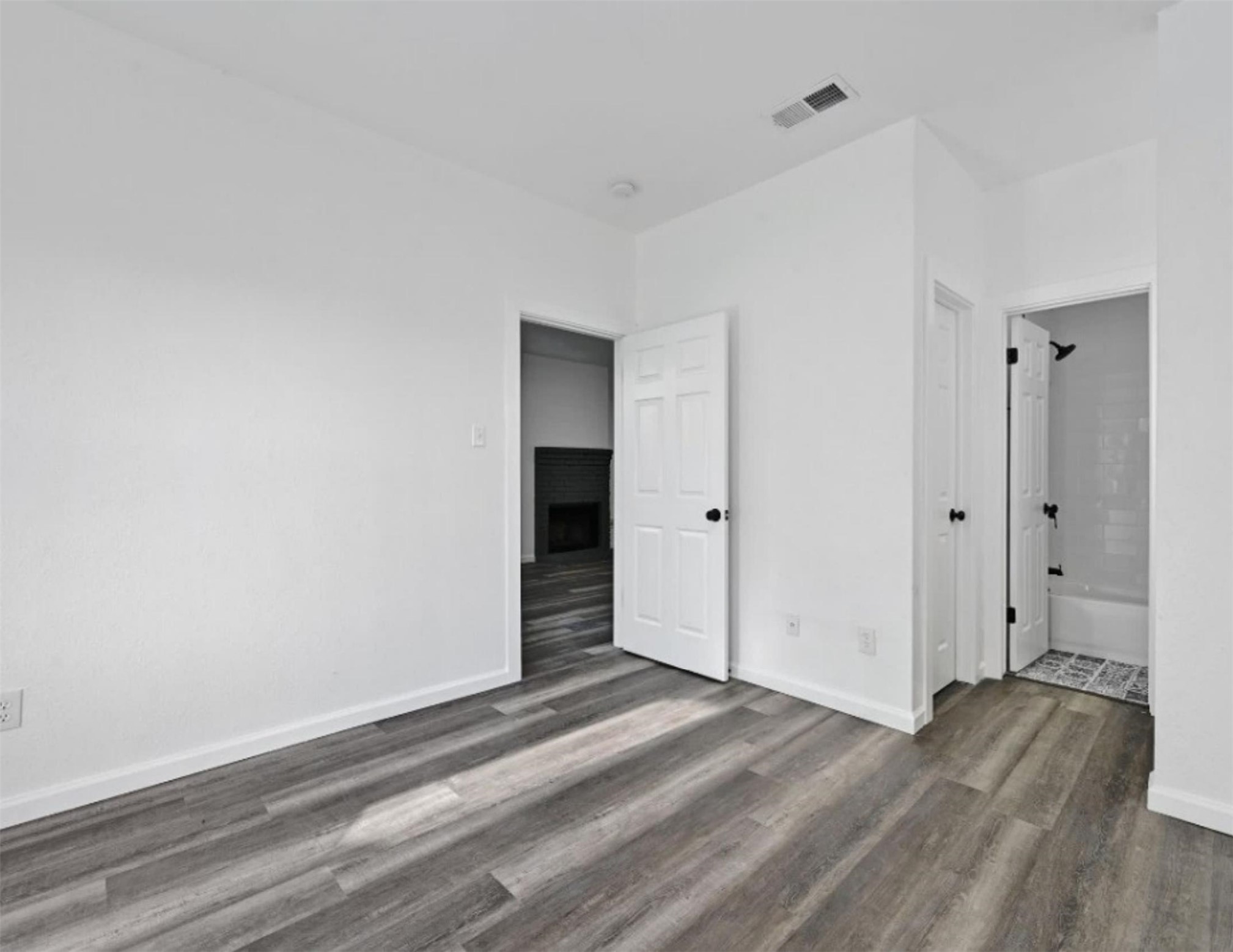 9508 Kempler Drive, Unit B Austin, TX 78748 - Photo 6 of 12 a view of empty room with wooden floor