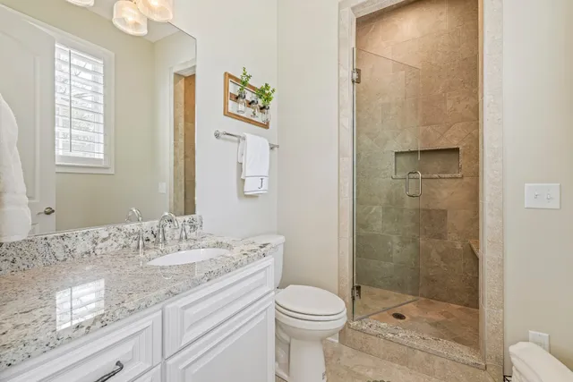 a living room with patio furniture and a yard