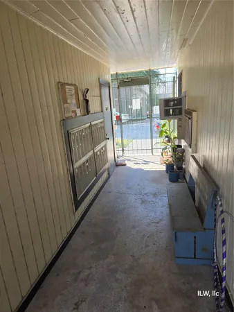 a view of a balcony with couch and wooden floor