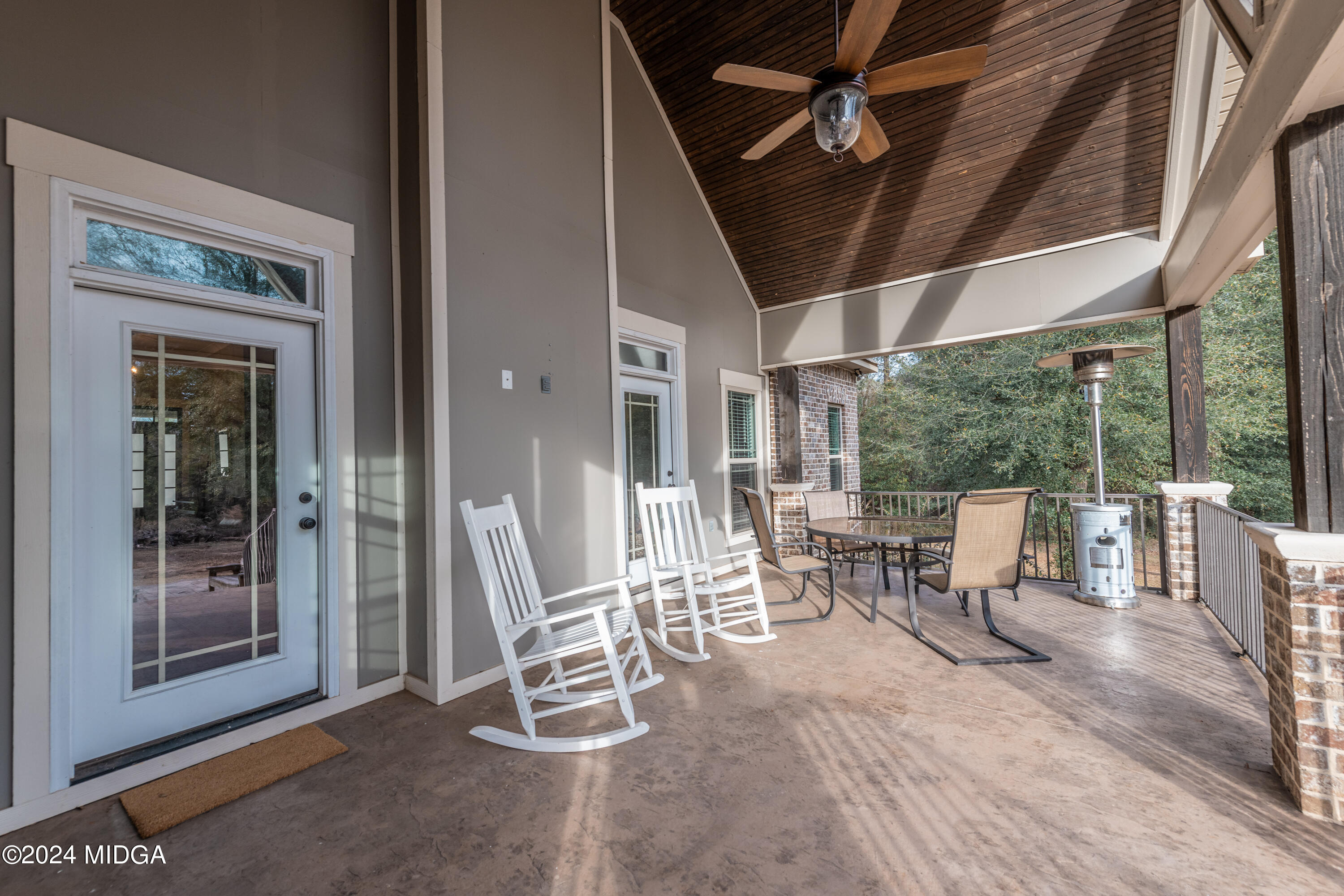 158 Harper Road Perry, GA 31069 - Photo 41 of 46 a outdoor space with lots of chairs and chandelier
