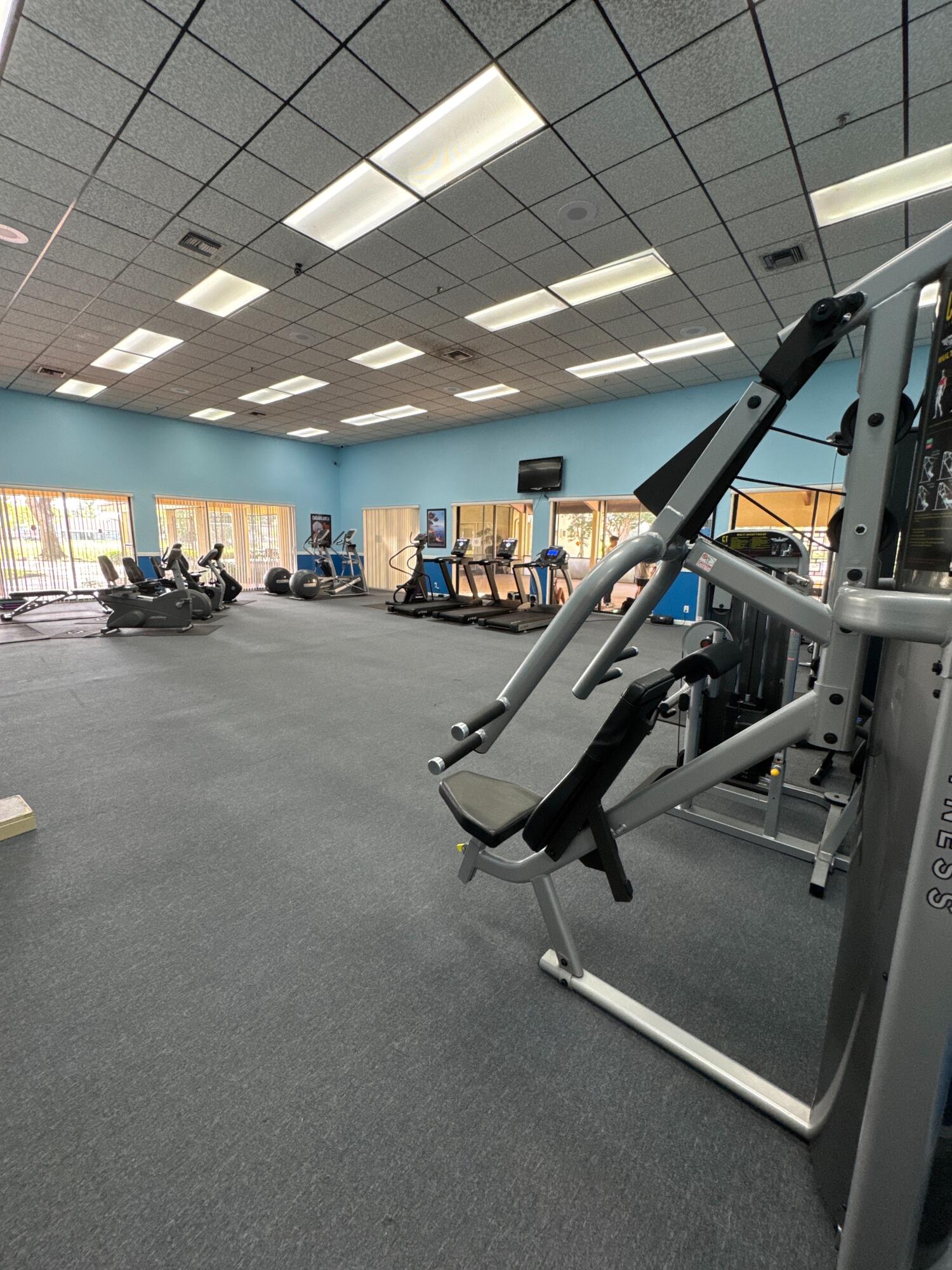 9503 Boca Cove Circle, Unit 602 Boca Raton, FL 33428 - Photo 20 of 24 a view of a room with gym equipment