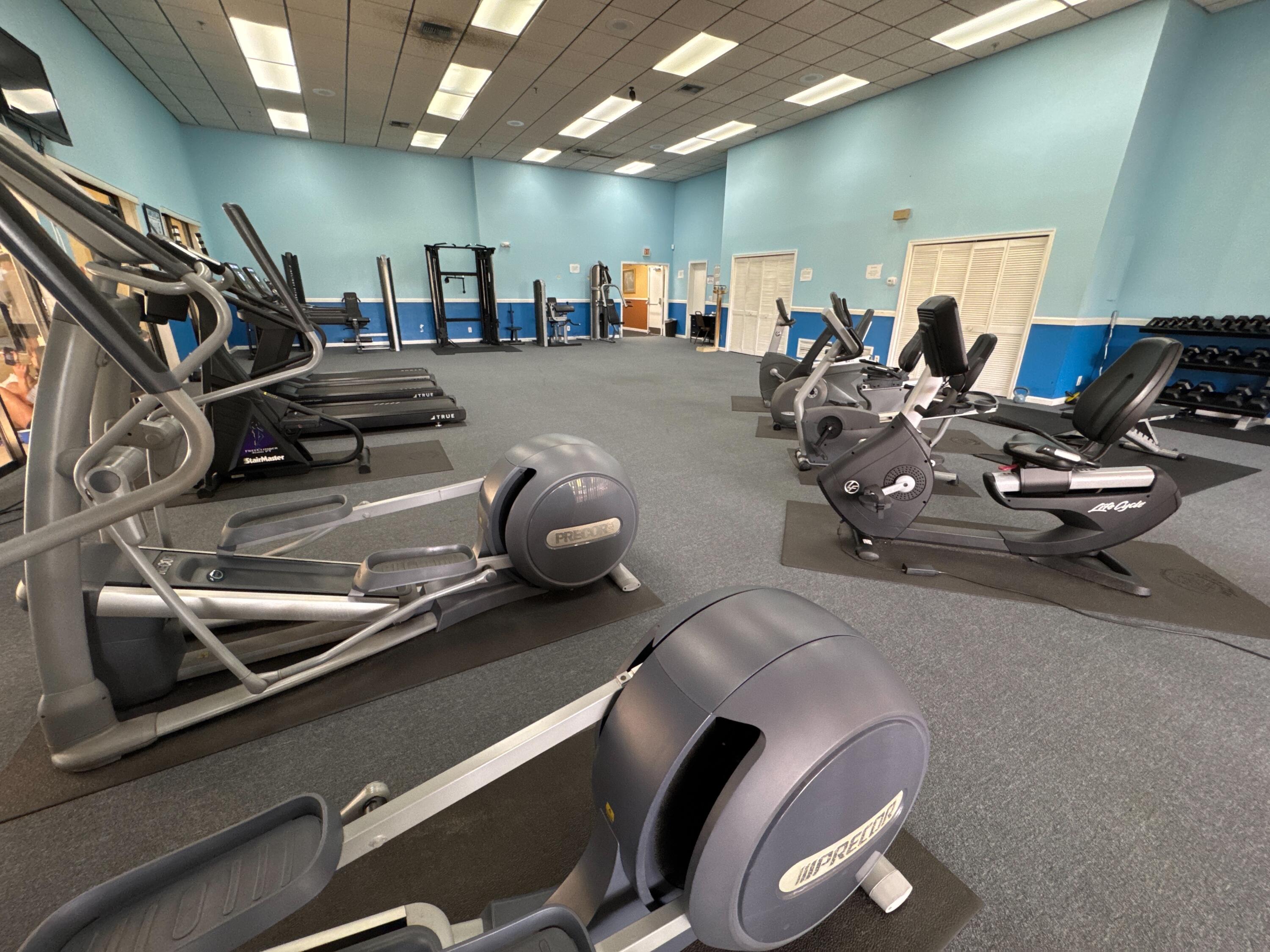 9503 Boca Cove Circle, Unit 602 Boca Raton, FL 33428 - Photo 21 of 24 a view of a room with gym equipment