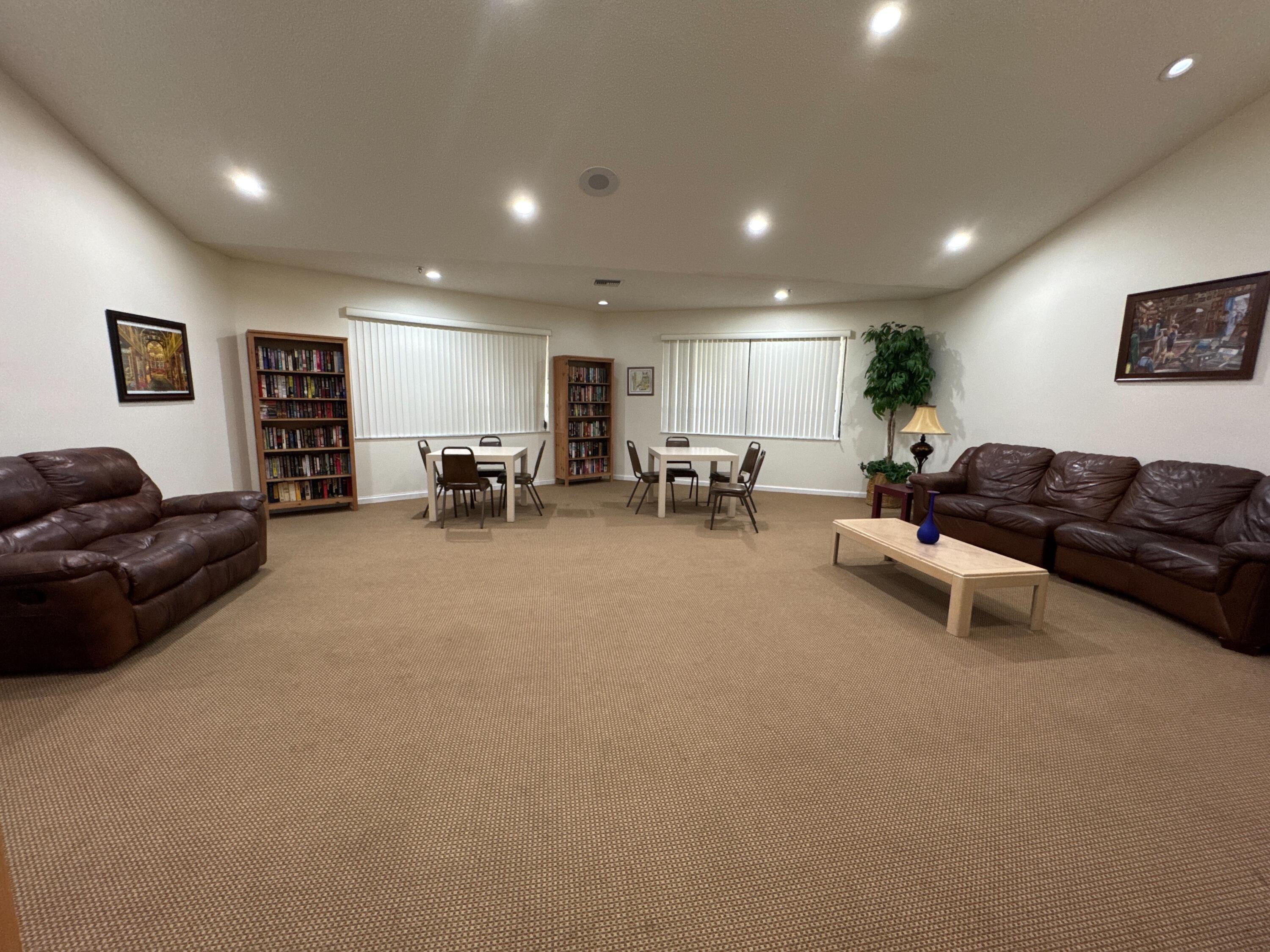 9503 Boca Cove Circle, Unit 602 Boca Raton, FL 33428 - Photo 22 of 24 a living room with furniture and a large window