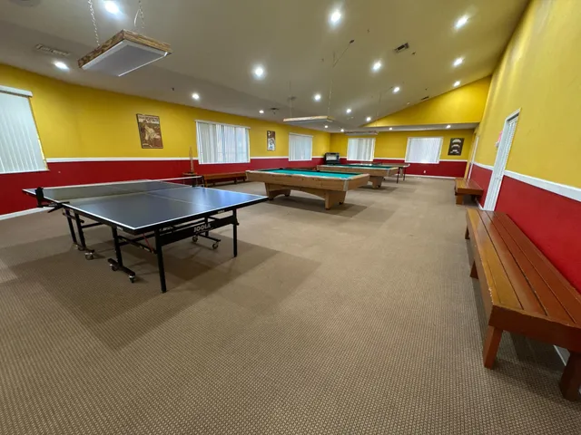 a view of a swimming pool with a yard