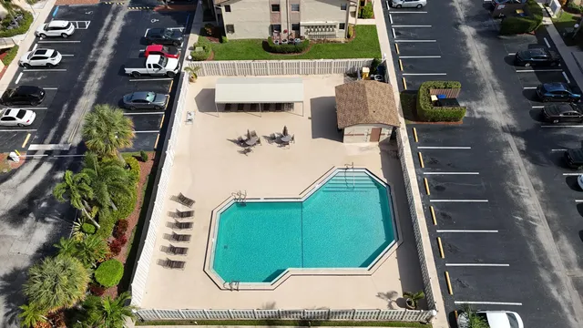 an aerial view of a kitchen with outdoor seating