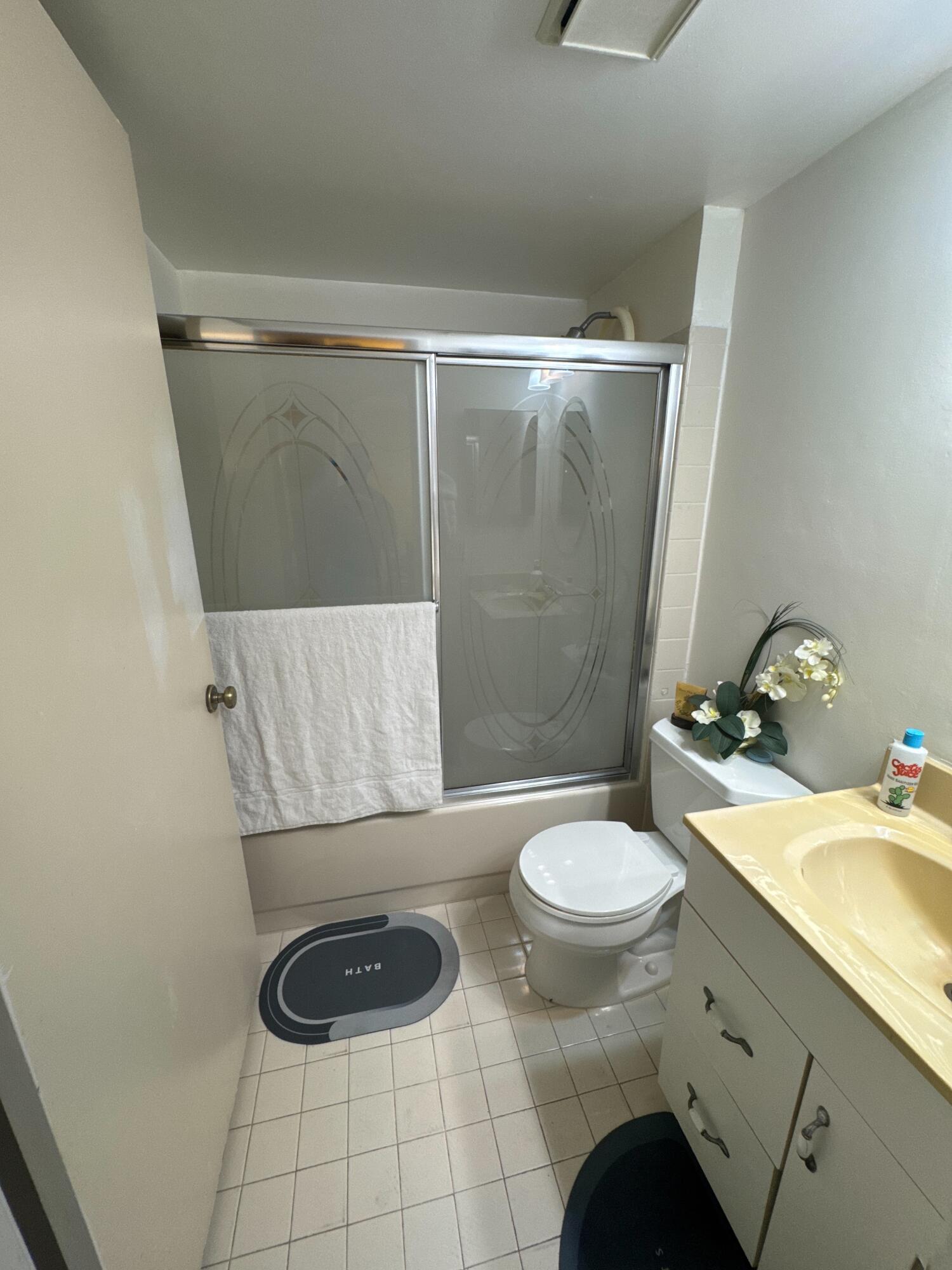 9503 Boca Cove Circle, Unit 602 Boca Raton, FL 33428 - Photo 10 of 24 a bathroom with a toilet and a sink