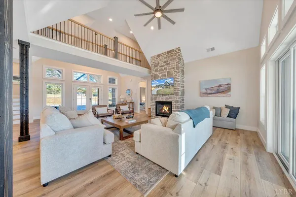 a kitchen with stainless steel appliances a dining table chairs stove microwave and cabinets