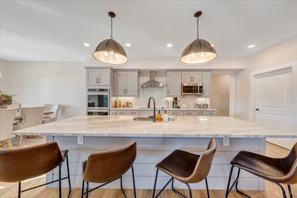 a spacious bathroom with a bathtub and shower