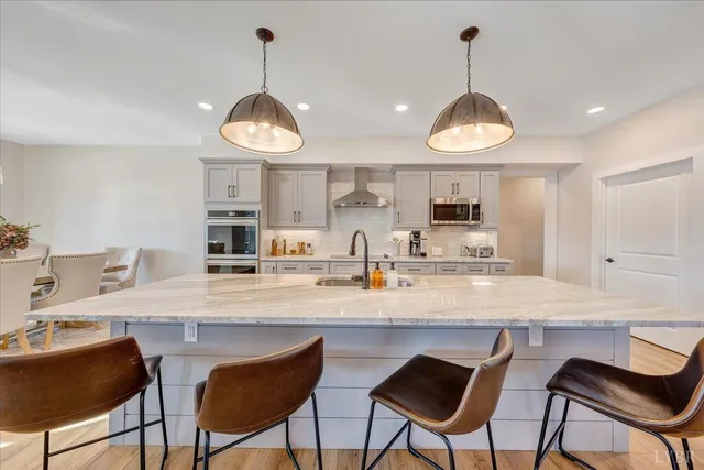 a spacious bathroom with a bathtub and shower