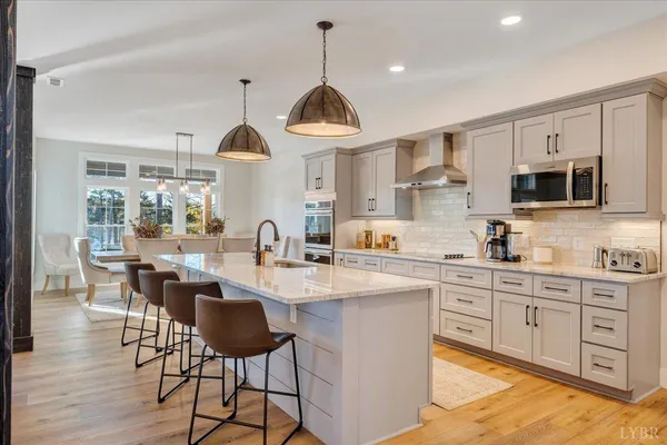 a view of a bedroom with wooden floor