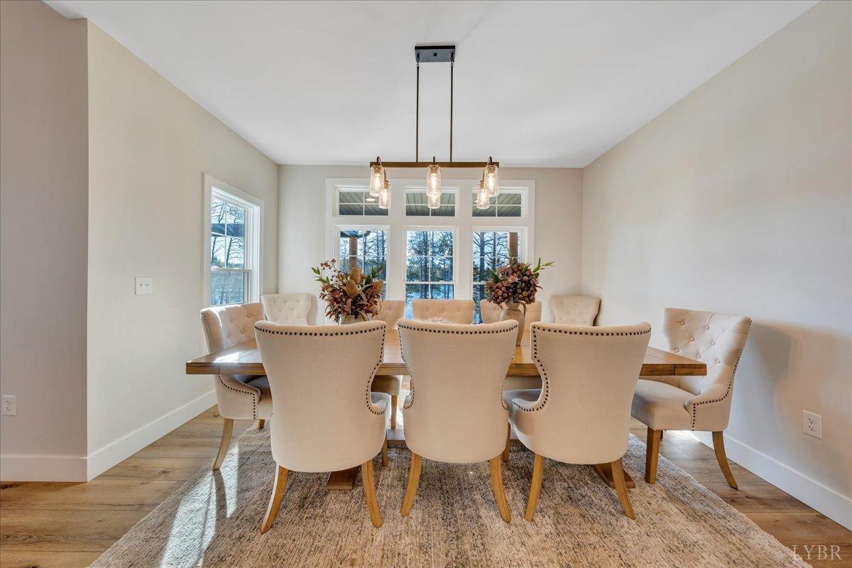 317 Bass Cove Road Huddleston, VA 24104 - Photo 18 of 90 a view of a dining room with furniture window and wooden floor