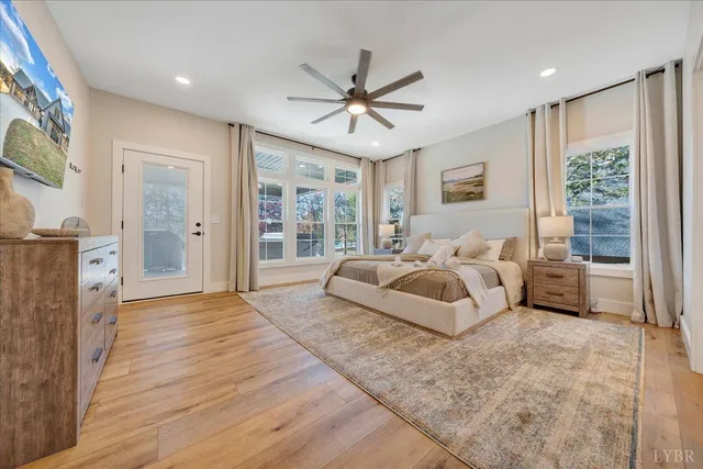 a en suite bathroom with a granite countertop tub and 2 sink