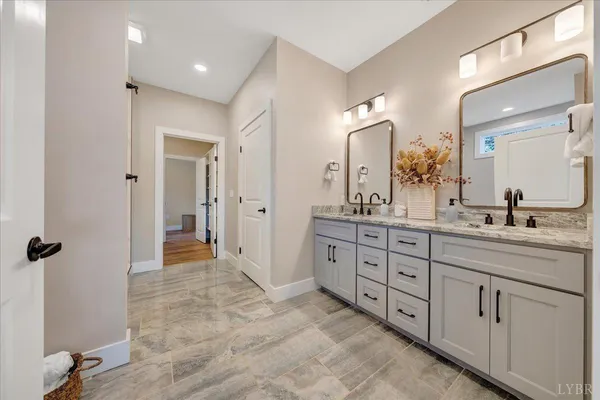 a bedroom with a large bed and a large window