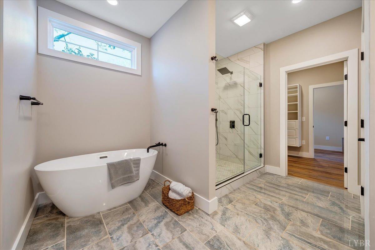 317 Bass Cove Road Huddleston, VA 24104 - Photo 25 of 90 a spacious bathroom with a bathtub and shower