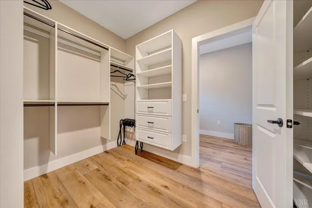 a bedroom with a bed and large window