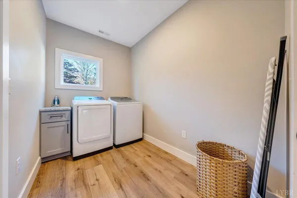 a view of a room with wooden floor