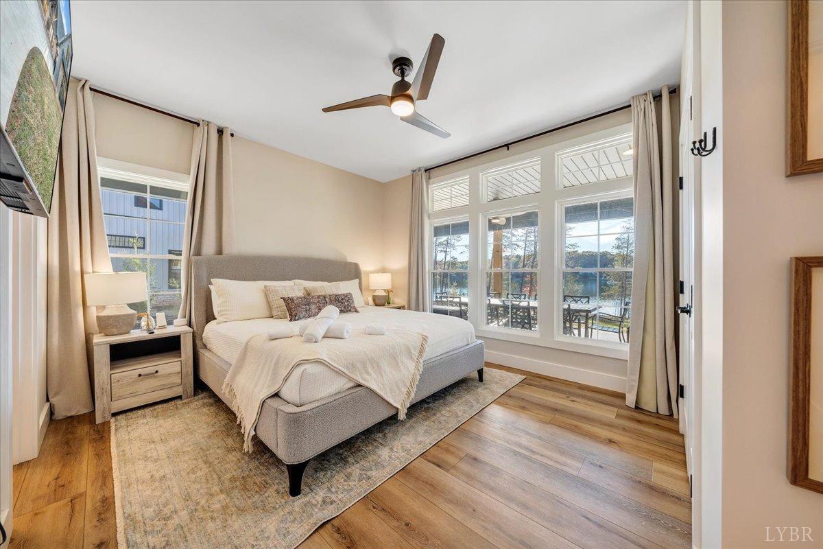 317 Bass Cove Road Huddleston, VA 24104 - Photo 38 of 90 a spacious bedroom with a bed and a large window