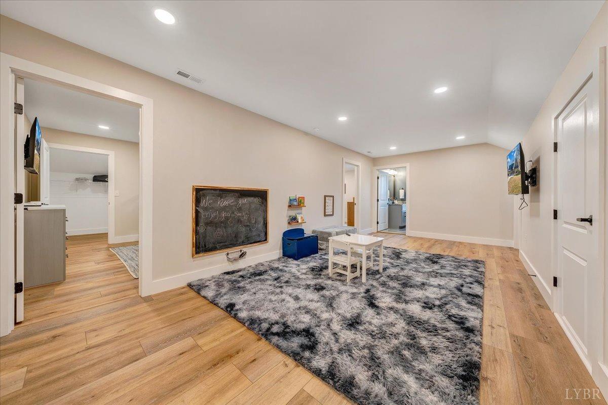 317 Bass Cove Road Huddleston, VA 24104 - Photo 41 of 90 a living room with a couch and a flat screen tv