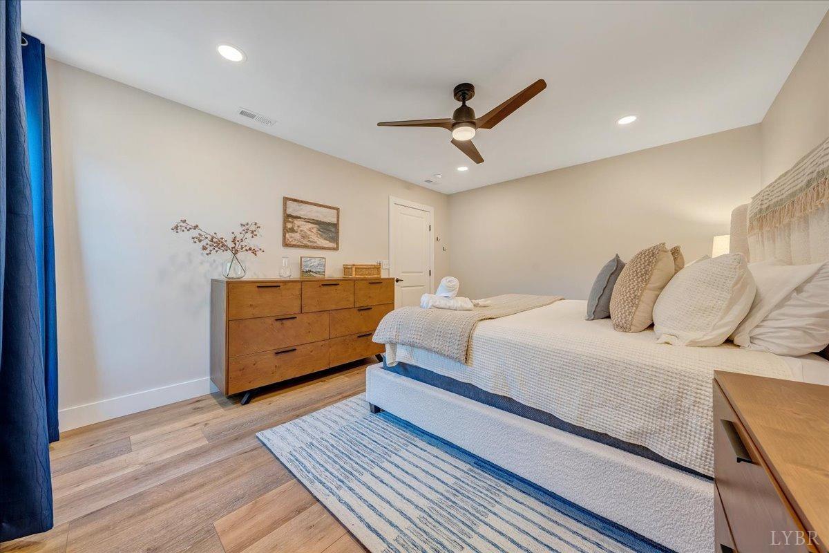 317 Bass Cove Road Huddleston, VA 24104 - Photo 43 of 90 a bedroom with a bed and a dresser