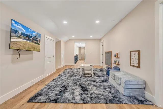 a view of a house with big yard and large tree