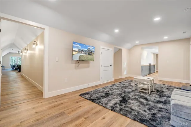 a view of a white house with a yard patio and fire pit