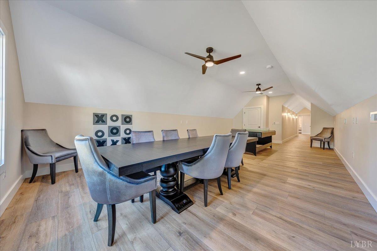 317 Bass Cove Road Huddleston, VA 24104 - Photo 48 of 90 a view of a dining room with furniture and wooden floor