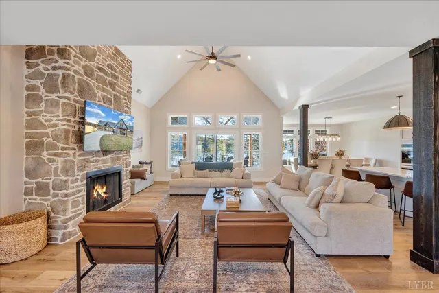 a large kitchen with stainless steel appliances granite countertop a lot of cabinets and wooden floor