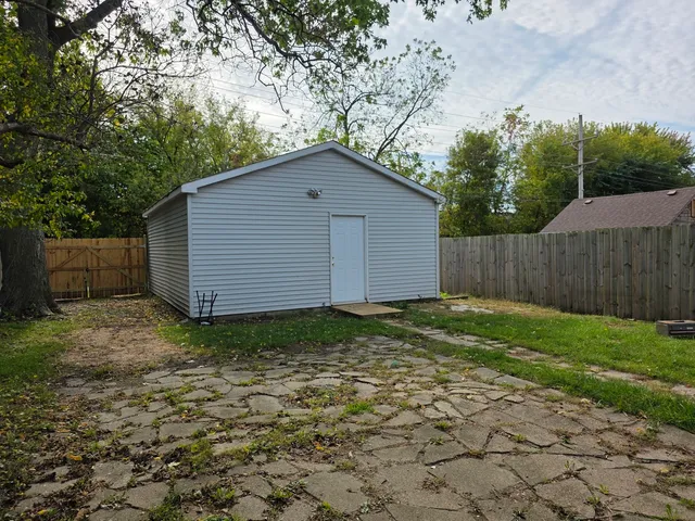 a house with trees in the background