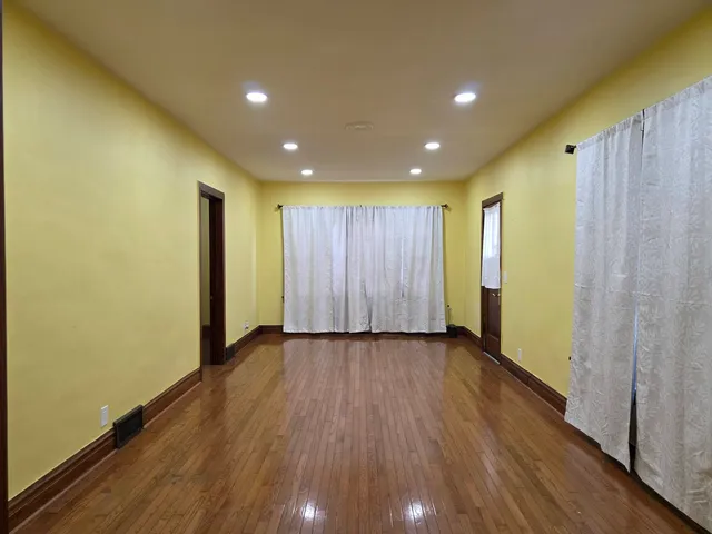 a view of a livingroom with wooden floor