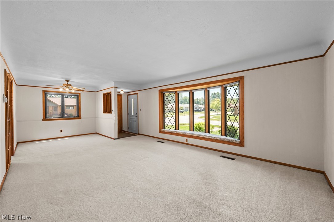 1759 Chelmsford Road Mayfield Heights, OH 44124 - Photo 3 of 39 Sizable and sunny front living room with hardwood floors under the carpeting