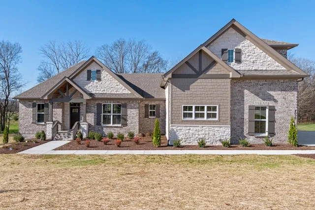 front view of a house with a yard