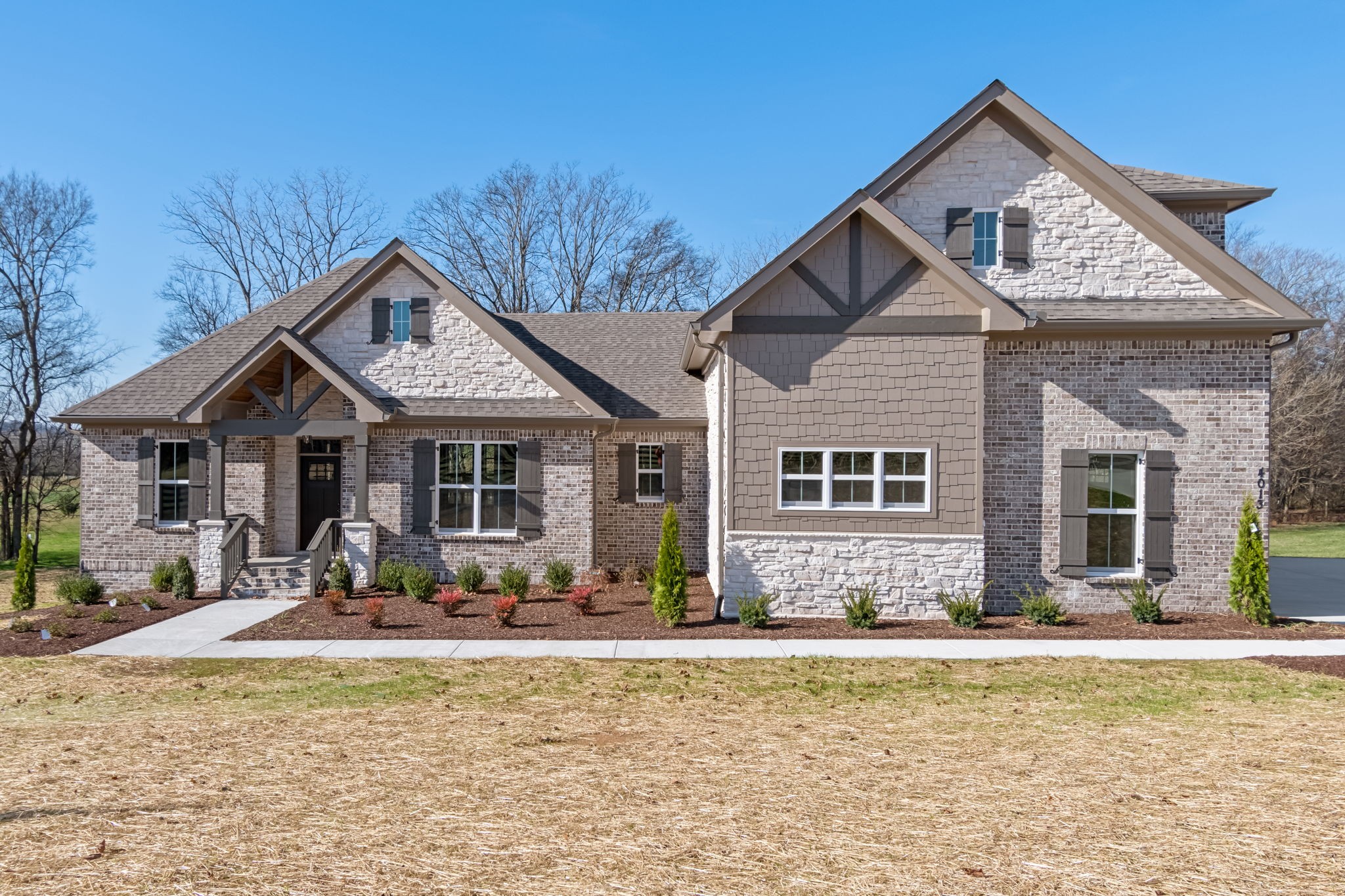 front view of a house with a yard