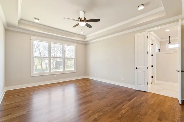 a view of entryway with wooden floor and stairs