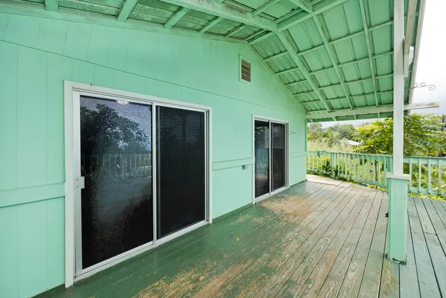 a kitchen with granite countertop white cabinets and stainless steel appliances