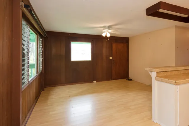 a view of a kitchen with a sink and a window