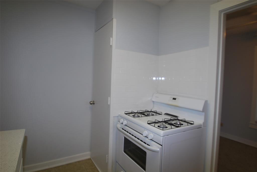 6918 Lockheed Avenue Dallas, TX 75209 - Photo 4 of 9 a kitchen with a stove and a refrigerator