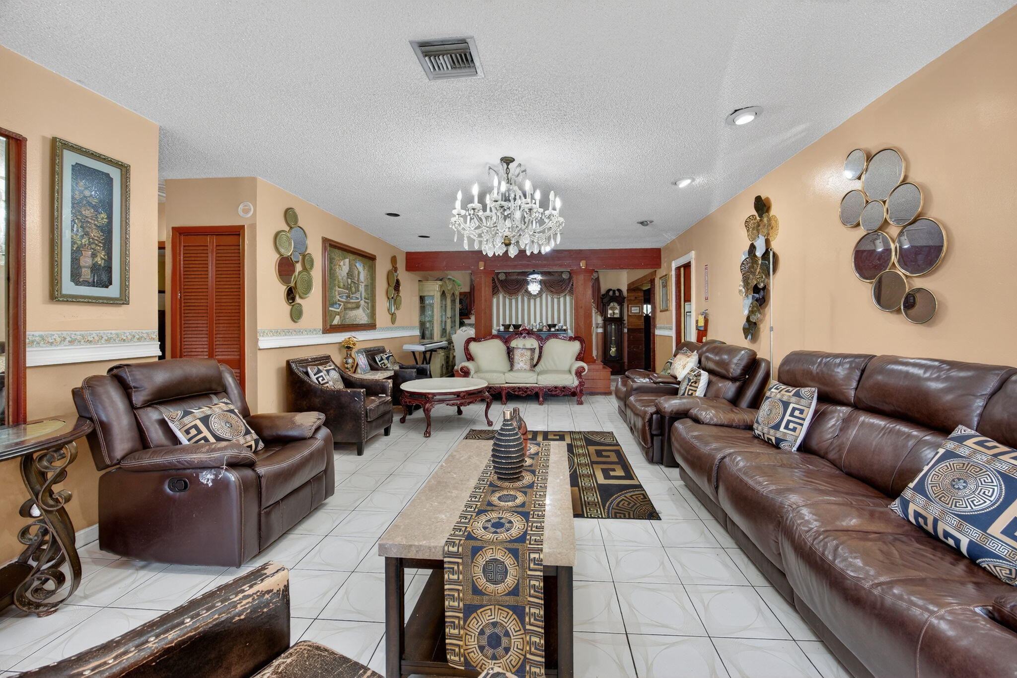 9281 Martinique Drive Miami, FL 33189 - Photo 12 of 35 a living room with furniture and a chandelier