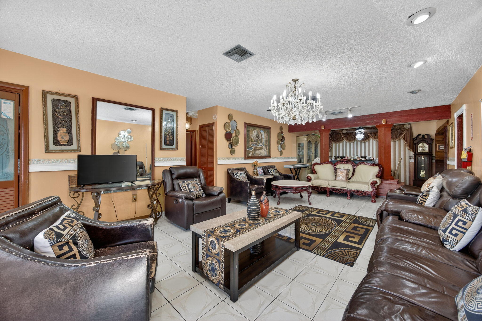 9281 Martinique Drive Miami, FL 33189 - Photo 13 of 35 a living room with furniture and a chandelier