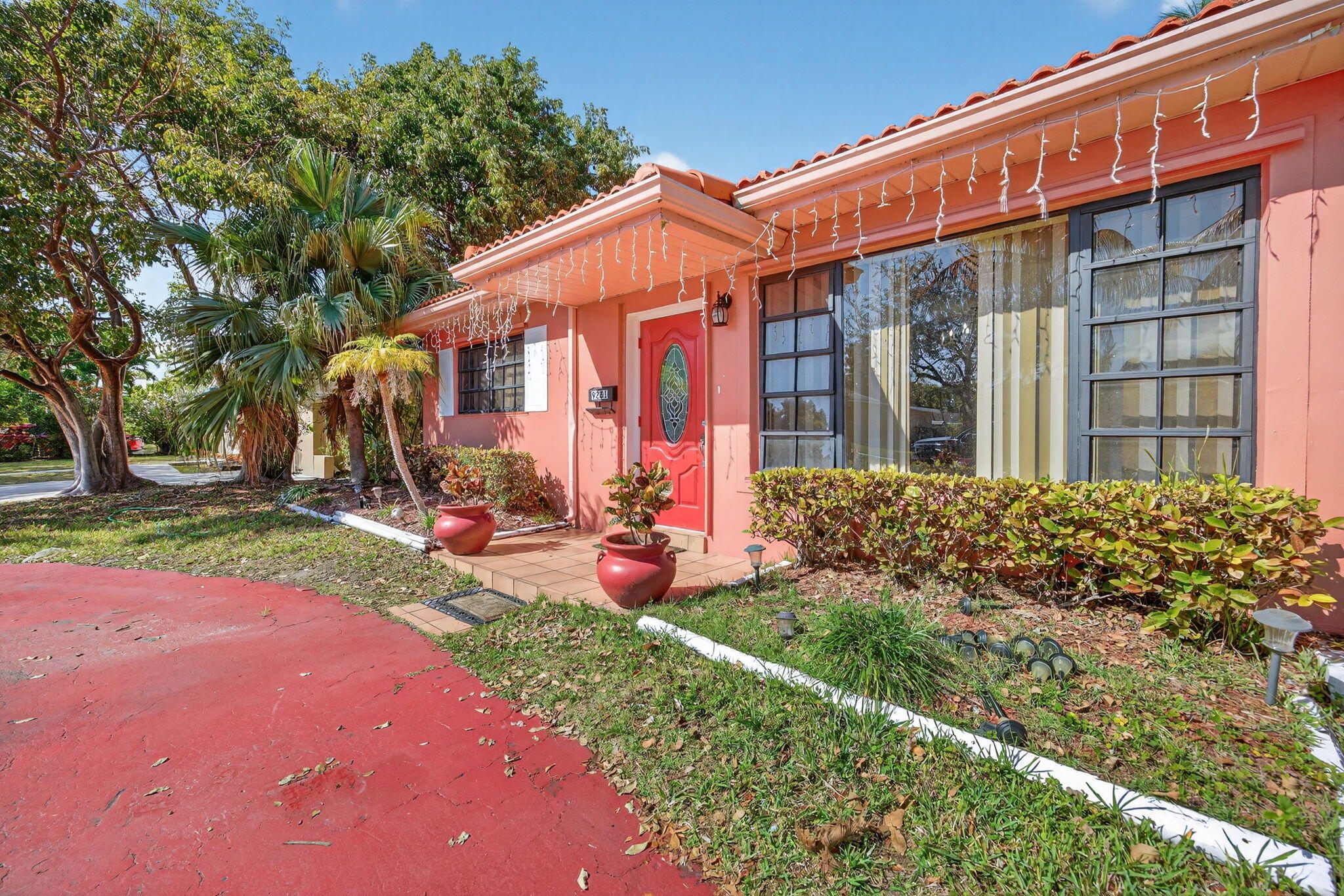 9281 Martinique Drive Miami, FL 33189 - Photo 2 of 35 a view of a house with backyard and sitting area