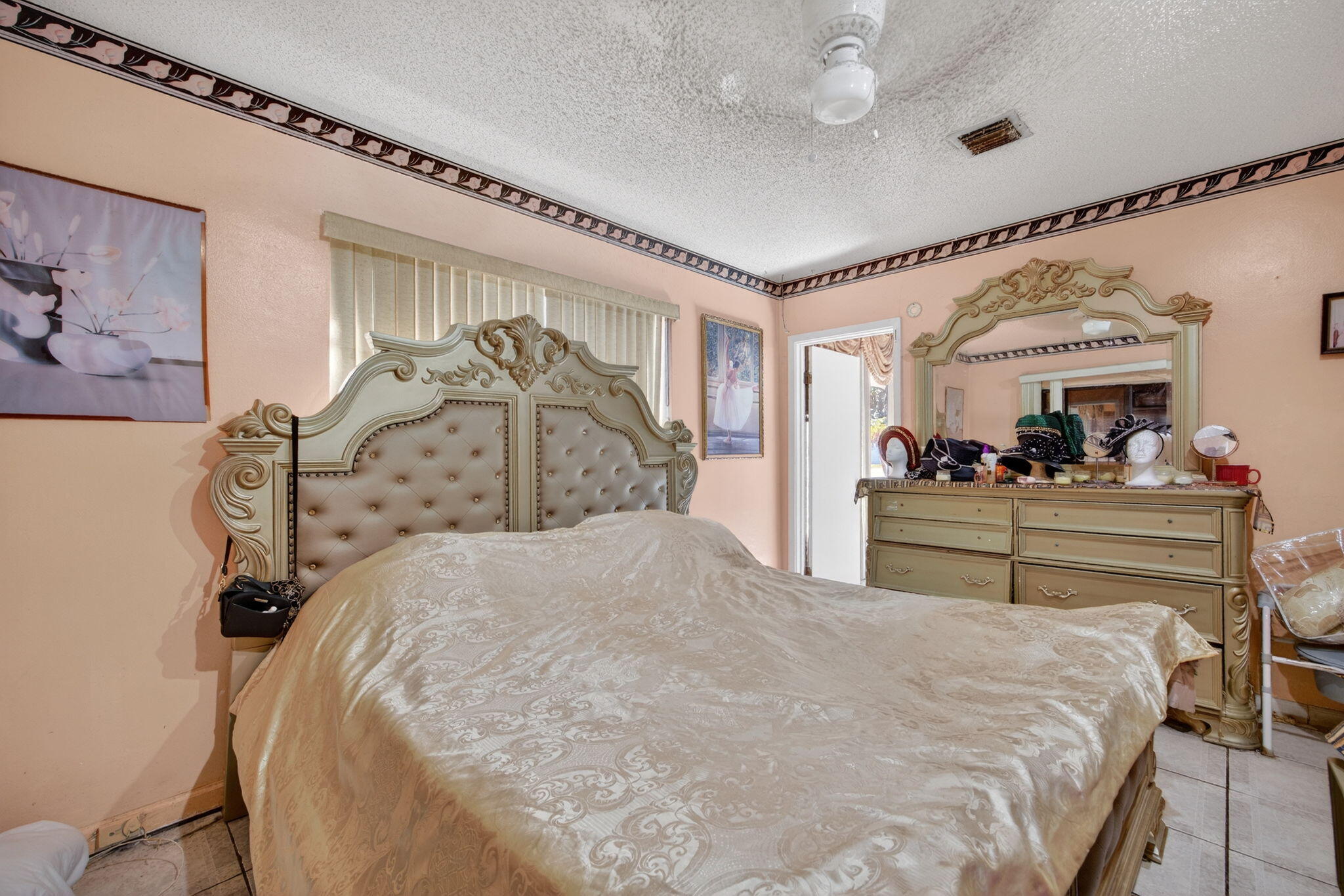 9281 Martinique Drive Miami, FL 33189 - Photo 21 of 35 a bed room with a bed and a mirror