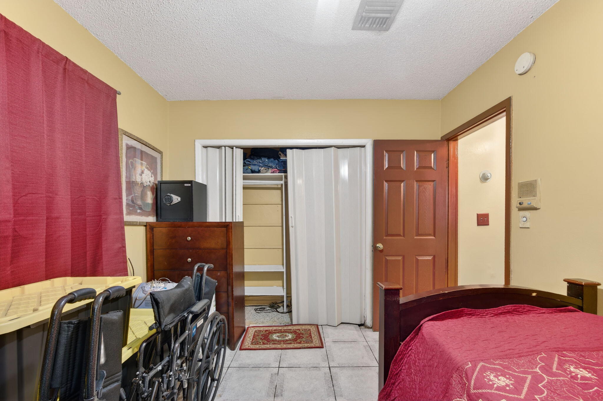 9281 Martinique Drive Miami, FL 33189 - Photo 27 of 35 a bedroom with a bed and a closet