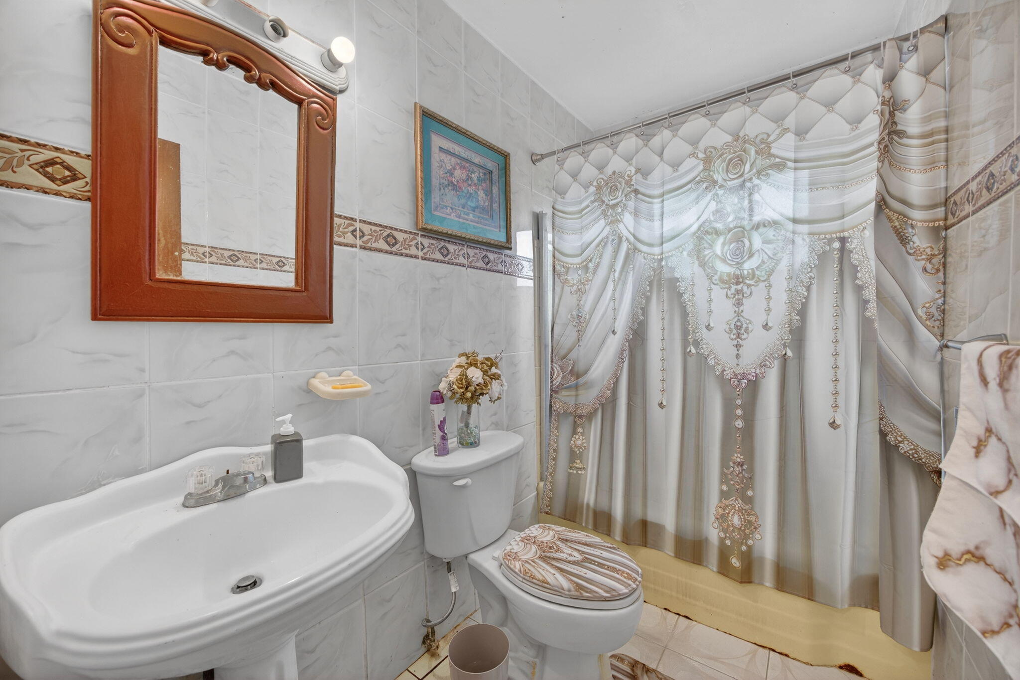 9281 Martinique Drive Miami, FL 33189 - Photo 28 of 35 a white toilet sitting next to a bathroom sink