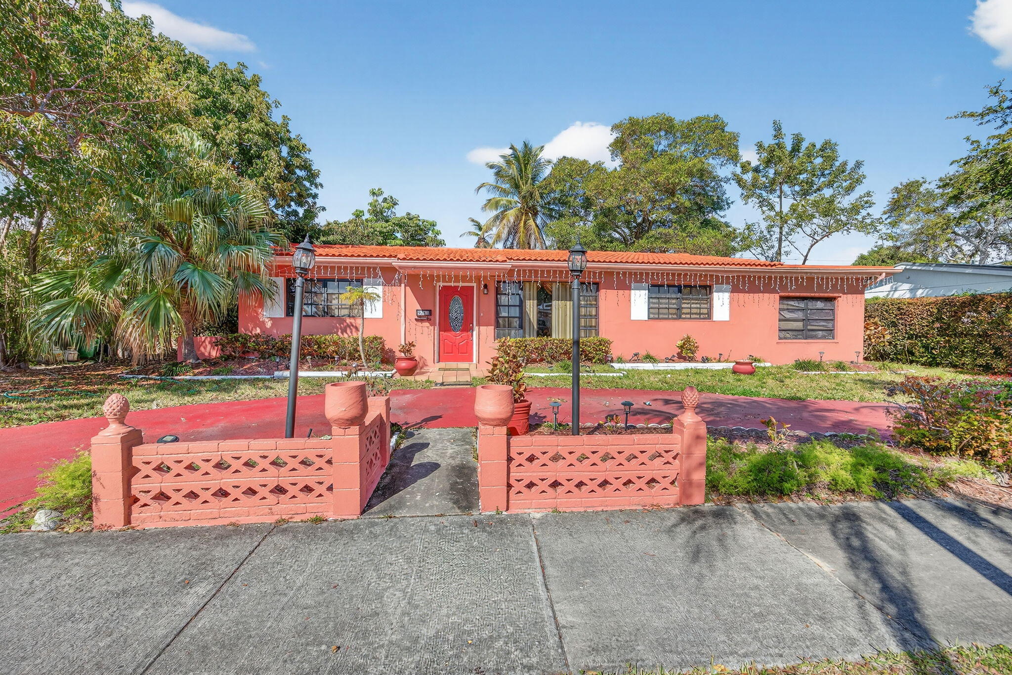 9281 Martinique Drive Miami, FL 33189 - Photo 4 of 35 front view of a house with a street