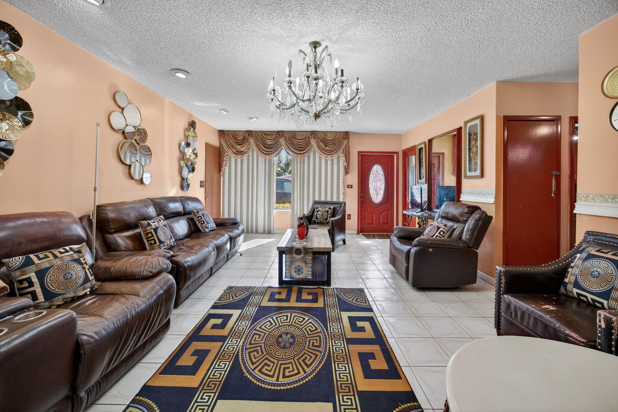 9281 Martinique Drive Miami, FL 33189 - Photo 7 of 35 a living room with furniture a chandelier and a rug